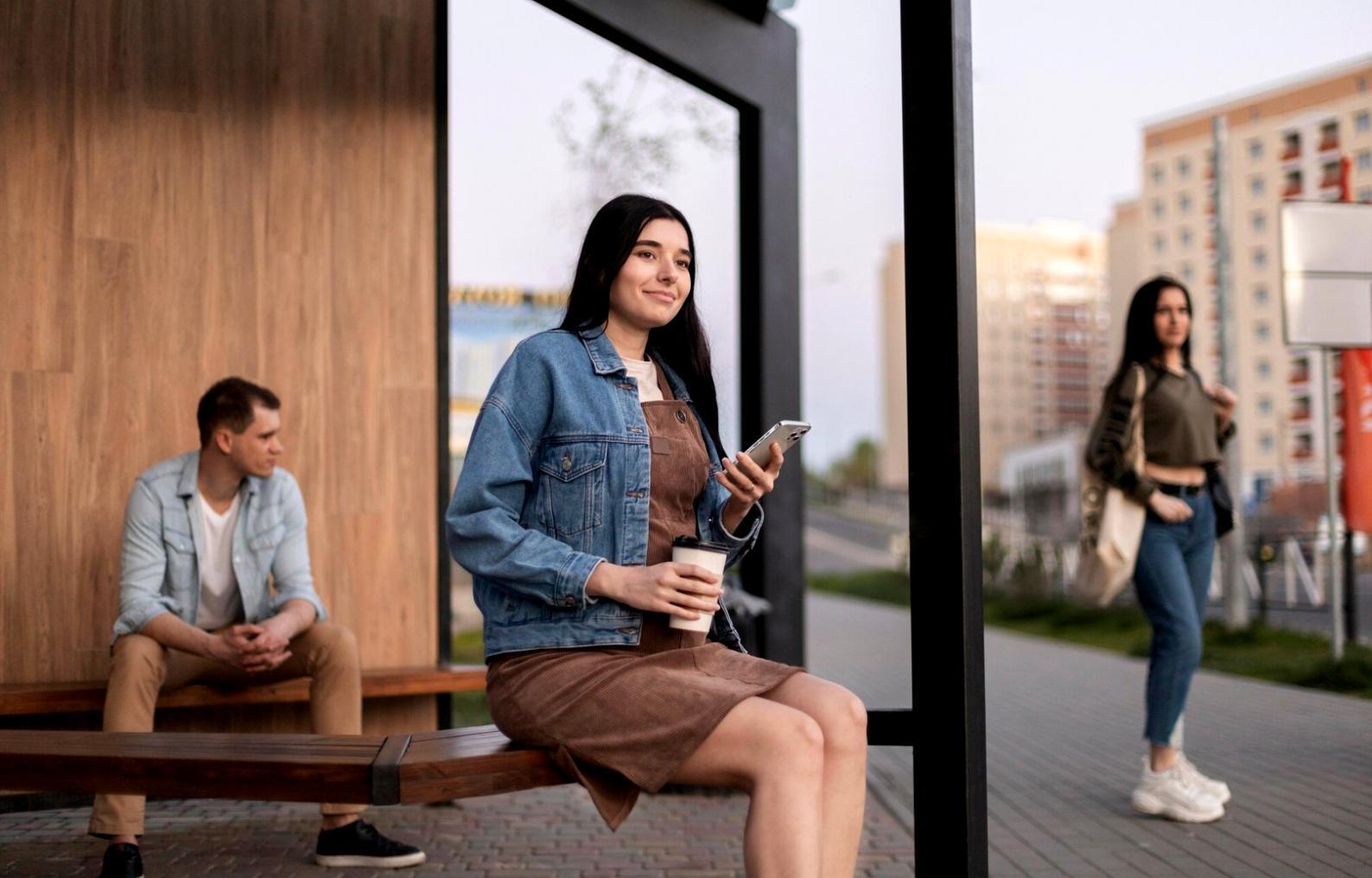Spreadsheet analysis with calculator on wooden desk