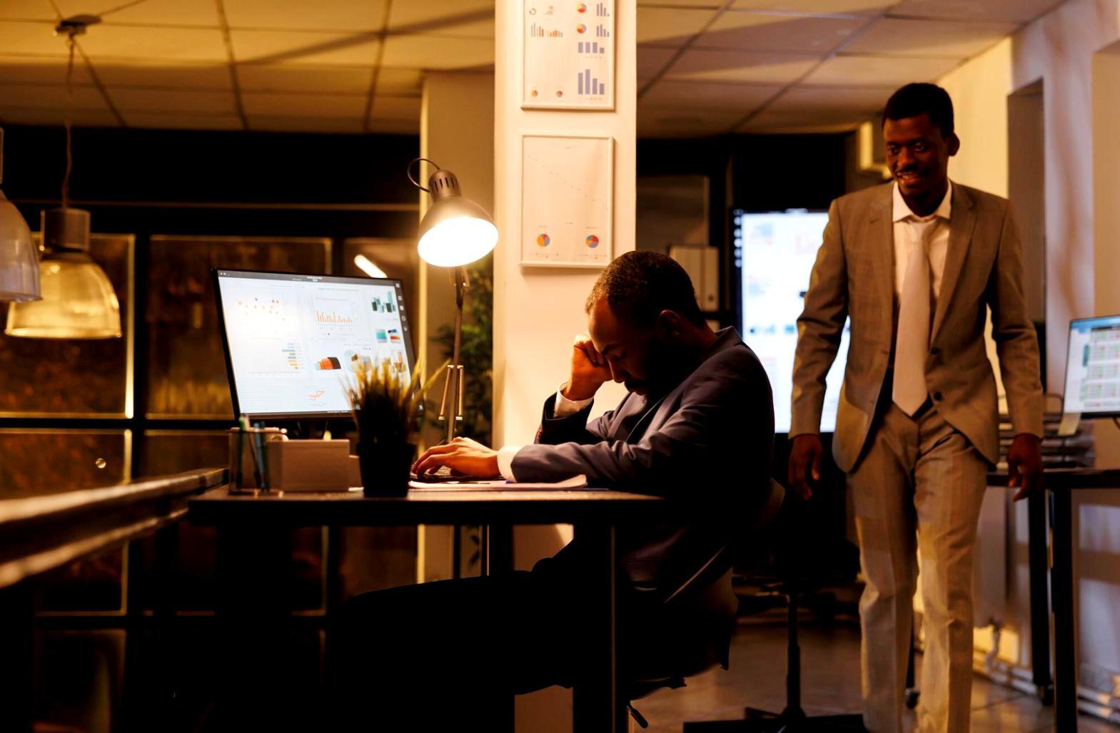 Modern office workspace with laptop and financial charts