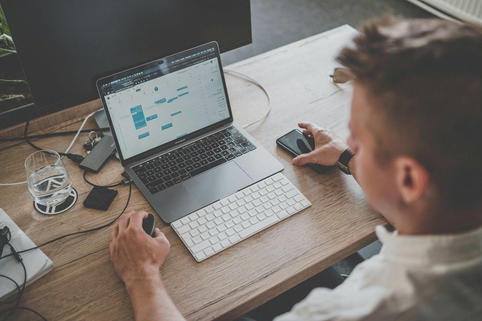 Small business owner reviewing financial documents and planning budget